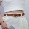 Slim brown leather belt for women featuring an oval matte gold metal buckle - Camel