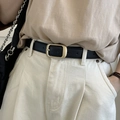 Detail of black leather belt with rectangular gold buckle on white denim trousers - Black