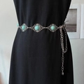 Detail of vintage bohemian silver metal waist chain with turquoise stones and floral patterns - Hollow Silver