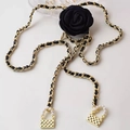 Elegant gold metal waist chain featuring black camellia and mini bag charms with pearls - Black Camellia Chain