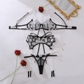 Flat lay of heart embroidery lingerie set with black mesh and ribbon details - S / Black & White