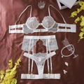 Detailed view of white floral embroidery and eyelash lace on a sheer 3-piece lingerie set - S / White