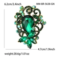 Vintage gouden broche met een grote druppelvormige groene kristal en kleurrijke strass - Groen