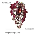 Detailed view of vintage alloy brooch with dimensions 9.3cm x 6.6cm and magenta crystals - Purple