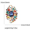 Grande spilla vintage in lega con cristalli colorati e una gemma blu al centro - Multicolore (0099-MX)