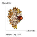 Retro amber glass flower brooch with champagne crystals in golden alloy finish - Brown