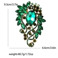 Vintage emerald green alloy brooch with crystals in gold finish measuring 9.3cm - Green