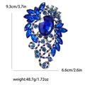Elegant gold alloy brooch with blue rhinestones and measurements 9.3cm by 6.6cm - Blue
