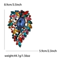 Vintage gold alloy brooch with large blue oval gemstone and colorful rhinestones - Rainbow
