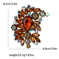 Spilla vintage dorata con goccia in vetro ambrato e strass colorati per abiti eleganti - Marrone