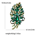 Large vintage Bohemian glass brooch with green crystals on a golden alloy base - Green