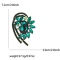 Detalle de broche de cristal esmeralda de lujo con dimensiones y peso del producto - Verde
