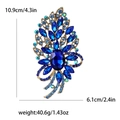 Vintage style golden alloy brooch with a large blue oval gemstone and sparkling rhinestones - Blue