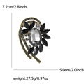 Lujoso broche de aleación con pedrería negra y piedra ovalada de cristal gris y oro - Negro