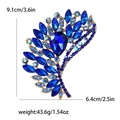 Luxurious feather-shaped alloy brooch with blue rhinestones and gold-plated finish - Blue