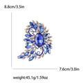Deep blue crystal rhinestone brooch pin with gold alloy base and large oval centerpiece - Blue