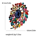 Alloy brooch with large dark blue oval center stone and multi-colored rhinestones - Colorful