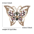 Elegante broche de mariposa dorada con diamantes de imitación y alas caladas para trajes - café