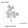 Silver clover brooch with inlaid white crystals and delicate curved stem design - Silver