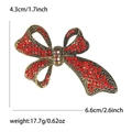 Vintage luxe strikbrosche met rode strassteentjes en afmetingen 4,3 cm x 6,6 cm - Antiek Goud Rood