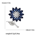 Silberne Sonnenblume-Brosche mit dunkelblauen Kristallen und weißen Strasssteinen - Silber
