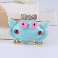 Blue enamel frog brooch with a gold rhinestone bow and cute pink eyes for suit decor - Blue
