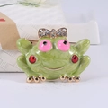Cartoon frog brooch with green enamel and gold bow knot featuring sparkling rhinestones - Green