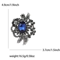 Vintage alloy brooch with oval blue gemstone and rhinestones, size 4.9cm x 3.7cm - Blue