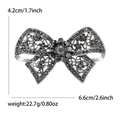 Elegante gunmetal-schwarze Schleifenbrosche mit dunklen Strasssteinen, 6,6 cm x 4,2 cm - Gunmetal