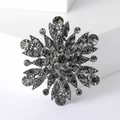 Dettaglio spilla a fiocco di neve vintage canna di fucile con strass grigio fumo lucidi - Nero