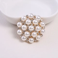 Elegant snowflake pearl brooch with gold alloy base and sparkling rhinestones - Gold