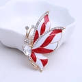 Elegante gouden vlinder speld met rood en wit email en fonkelende kristallen details - Wit