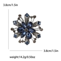 Elegant snowflake brooch with blue pear-shaped rhinestones and silver metal finish - Blue