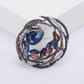 Broche de lujo con diseño de remolino y pedrería de colores con cristales azules - Azul