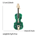 Elegante spilla a violino in smalto verde con accenti dorati e misure dettagliate - Verde