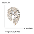 Elegant gold alloy brooch with clear rhinestones and intricate floral hollow design - Gold White