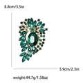 Green crystal vintage alloy brooch in gold finish with 8.8cm by 5.9cm dimensions - Green
