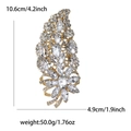 Luxurious gold leaf-shaped alloy brooch with clear rhinestones measuring 4.2 inches high - Gold White