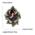 Vintage gold-toned rose brooch with purple rhinestones and large brown waterdrop gem - Purple