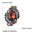 Vintage alloy brooch with red crystal and purple rhinestones, 5.4cm high with bronze base - Purple
