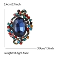 Vintage gold brooch with oval blue crystal and multicolor rhinestones, 5.4cm high - Colorful