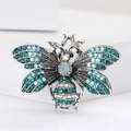 Broche abeille argentée avec strass bleus étincelants et cristaux sur support géométrique - Abeille en strass bleu