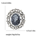Vintage oval relief brooch with female silhouette, silver frame and sparkling crystals - Silver