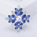 Elegante broche de estrella con perla central y cristales marquise en acabado plata - 1033 Azul