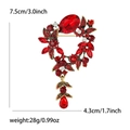 Vintage style red rhinestone floral wreath brooch with teardrop pendant in antique gold - Red