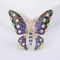 Elegante broche de mariposa en aleación dorada con alas de esmalte colorido y pedrería - Morado