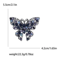 Vintage zilveren vlinderbroche met blauwe kristallen en filigraan gevleugelde details - Donkerblauw