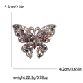 Vintage zilveren vlinderbroche met kleurrijke kristallen en filigraan details - Bruin