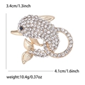 Goldene Delfin-Brosche mit weißen Strasssteinen, Maße: 4,1 cm Breite und 3,4 cm Höhe - Gold
