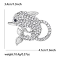 Silberne Delfin-Brosche mit weißen Kristallen und blauem Auge, Maße 3,4 cm x 4,1 cm - Silber